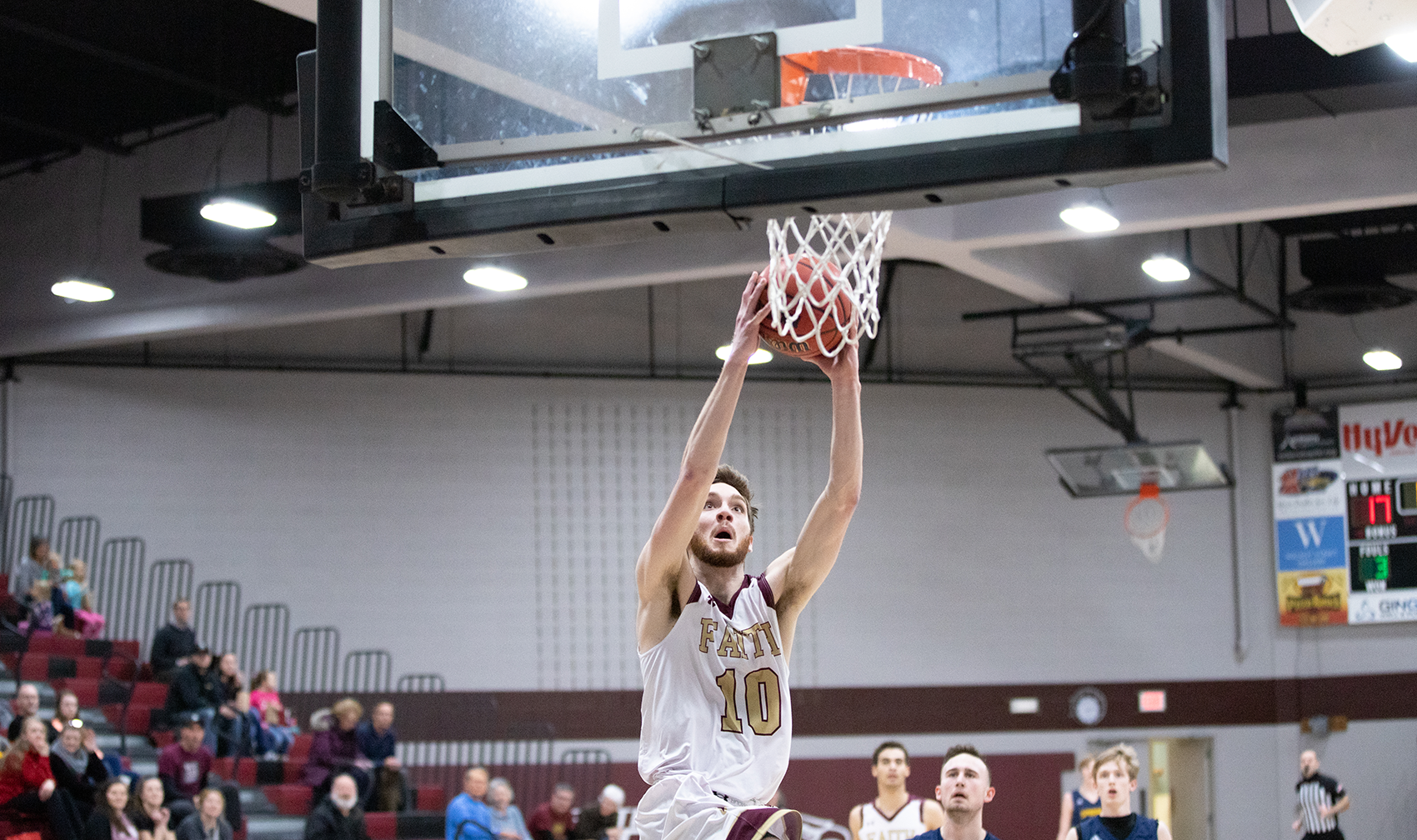 Christian Brown's dunk sparked the Eagles to a win over Spurgeon College.