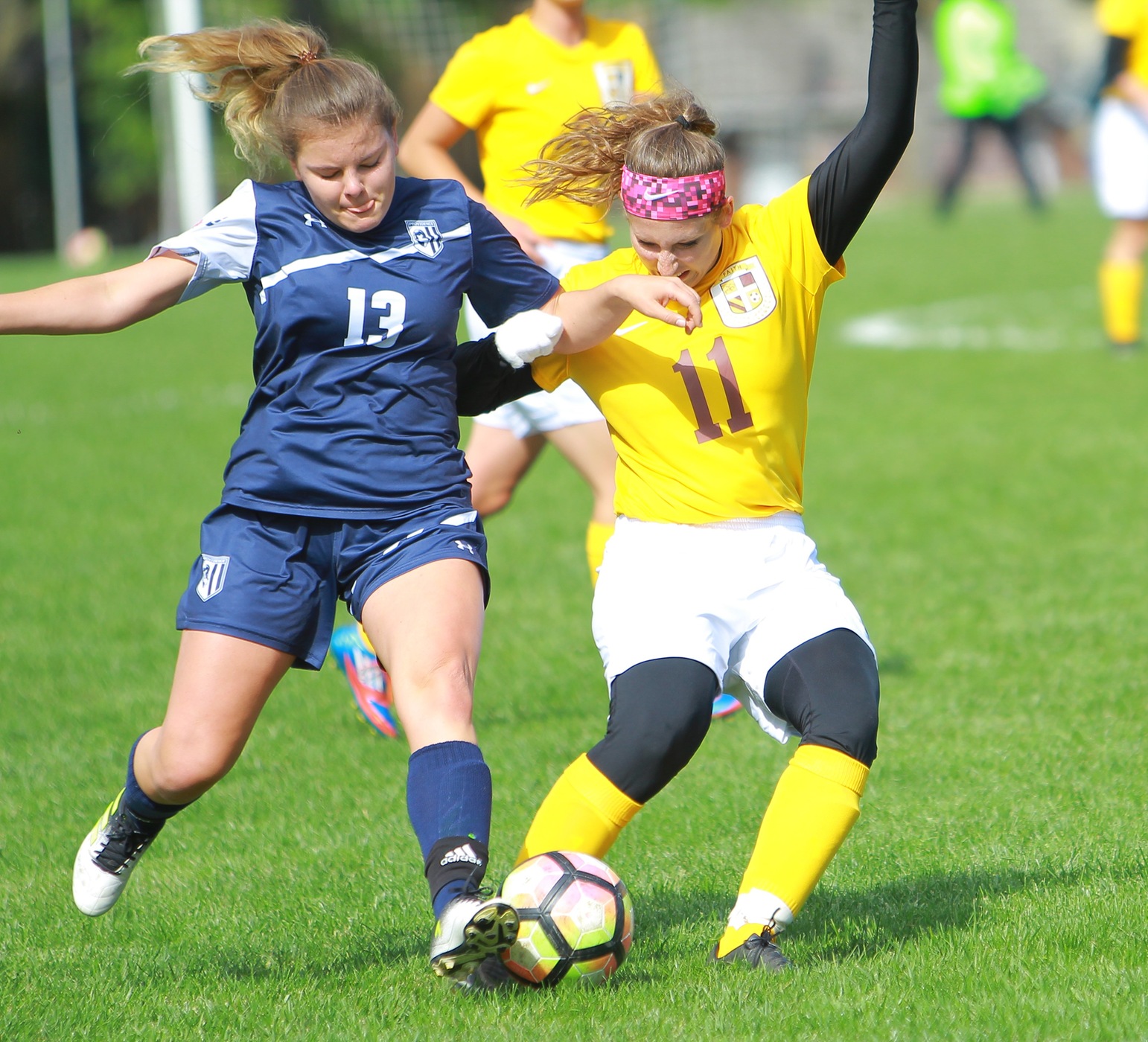 Jessica Frerichs fights for the ball against a Providence defender