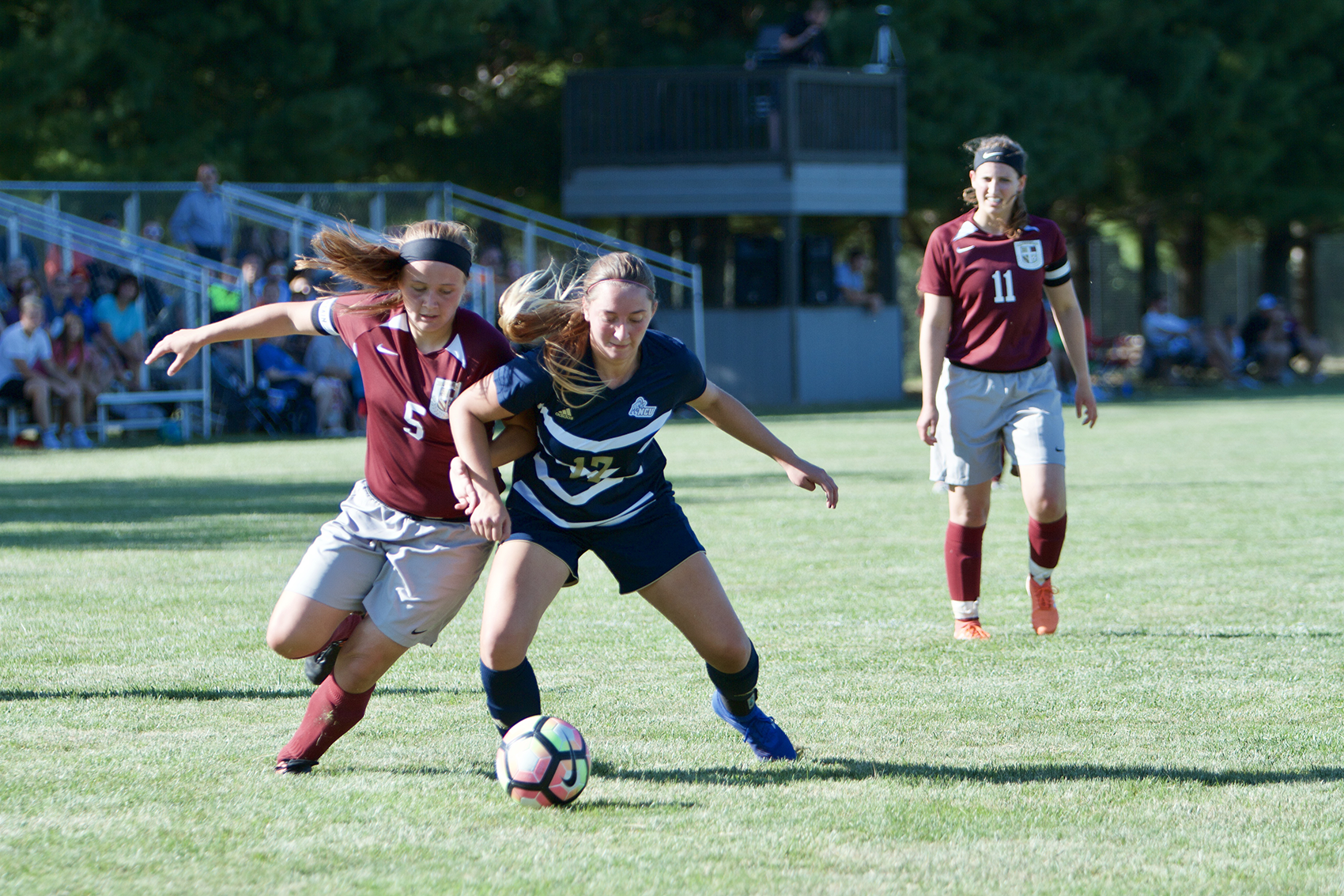 Lyndi Shepard battles for the ball against North Central University. Photo Credit: Rebecca White