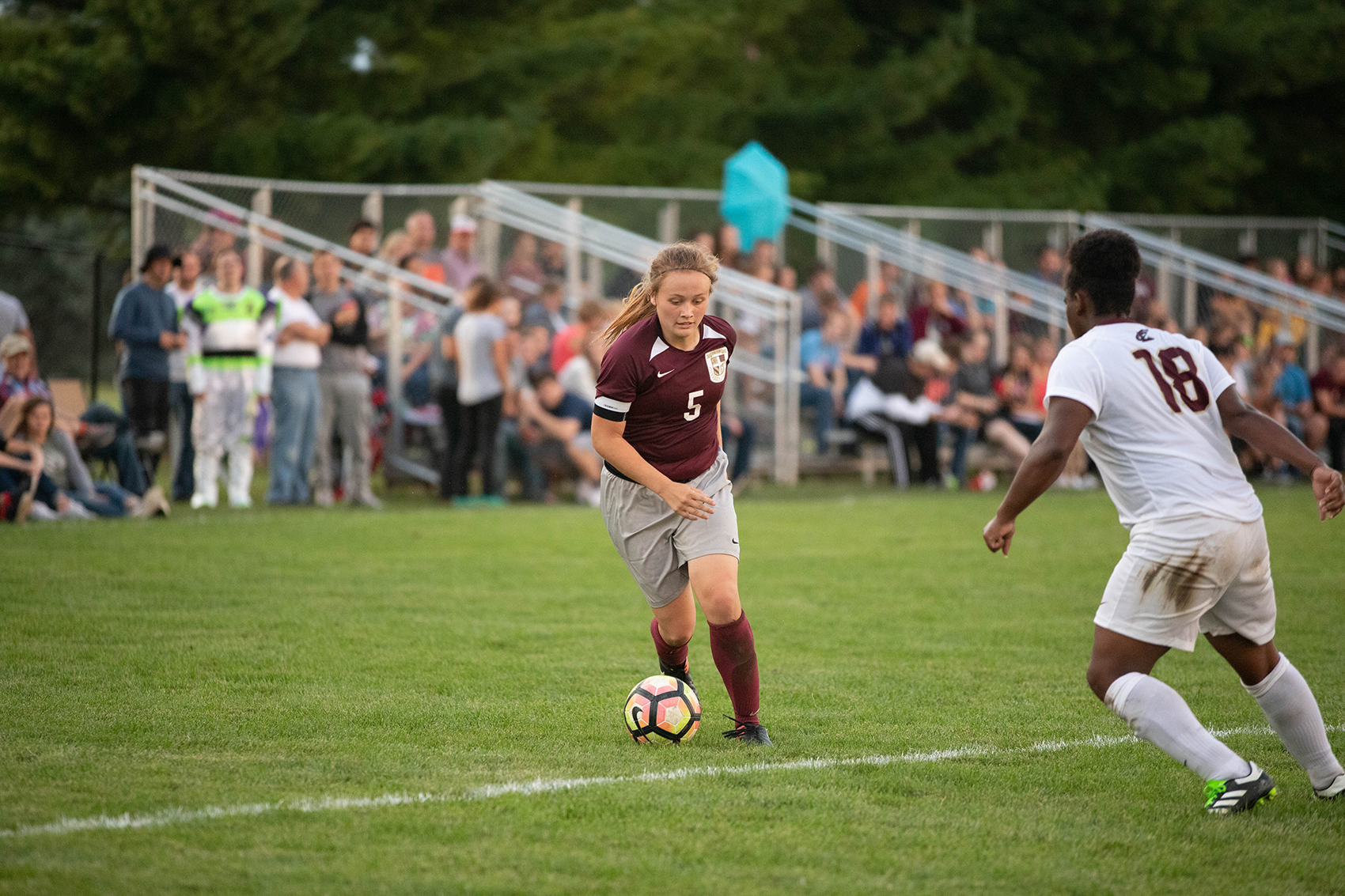 Lyndi Shepard drives to the goal against Eureka College (Photo Credit: Brittany Appell)