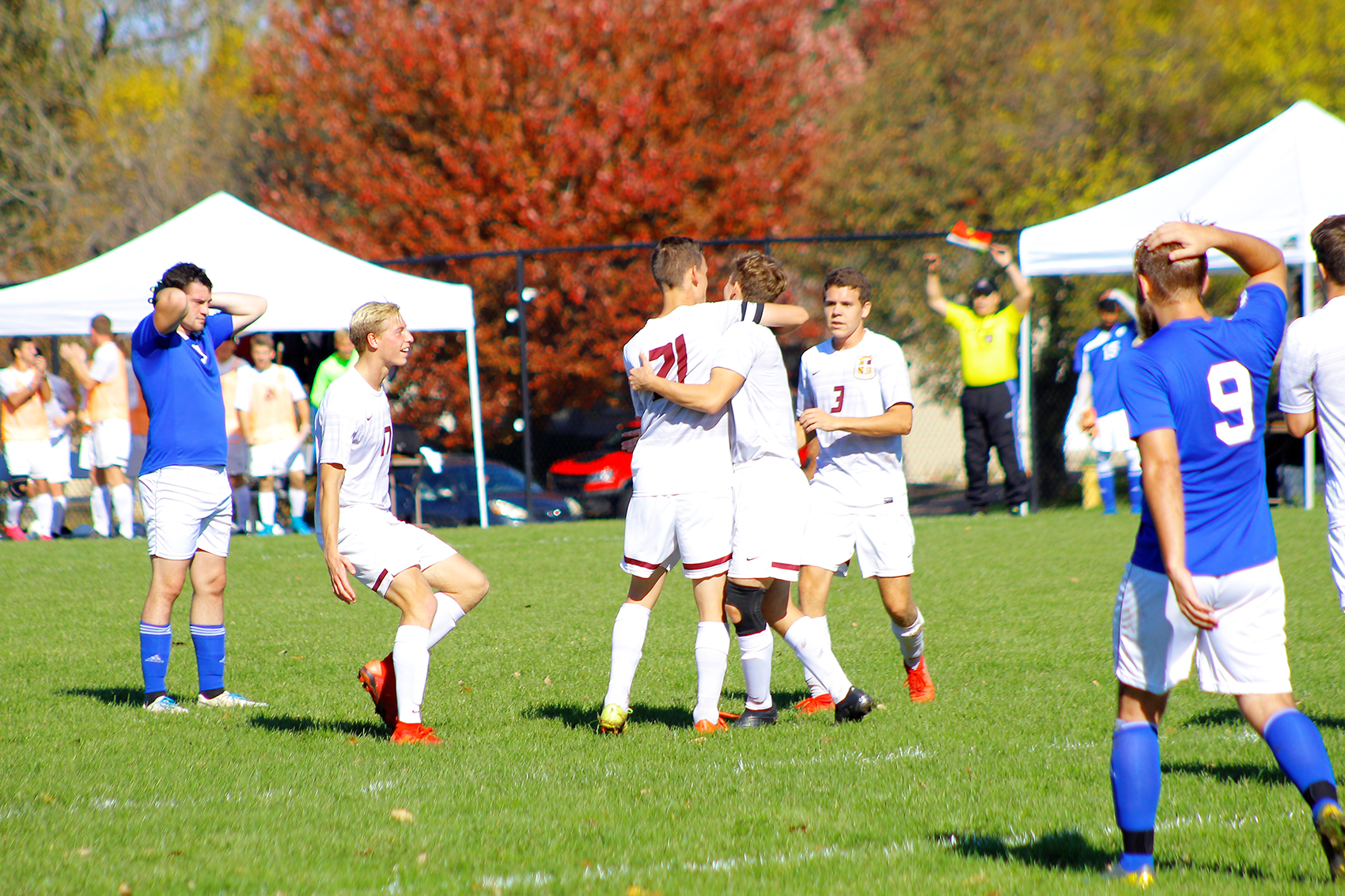 Eagles players congratulate Isaac Mosher after his goal gave Faith a 1-0 lead.